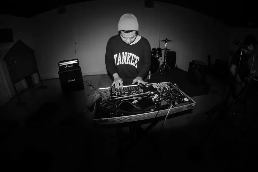 Black and white photo of Welige at a controller